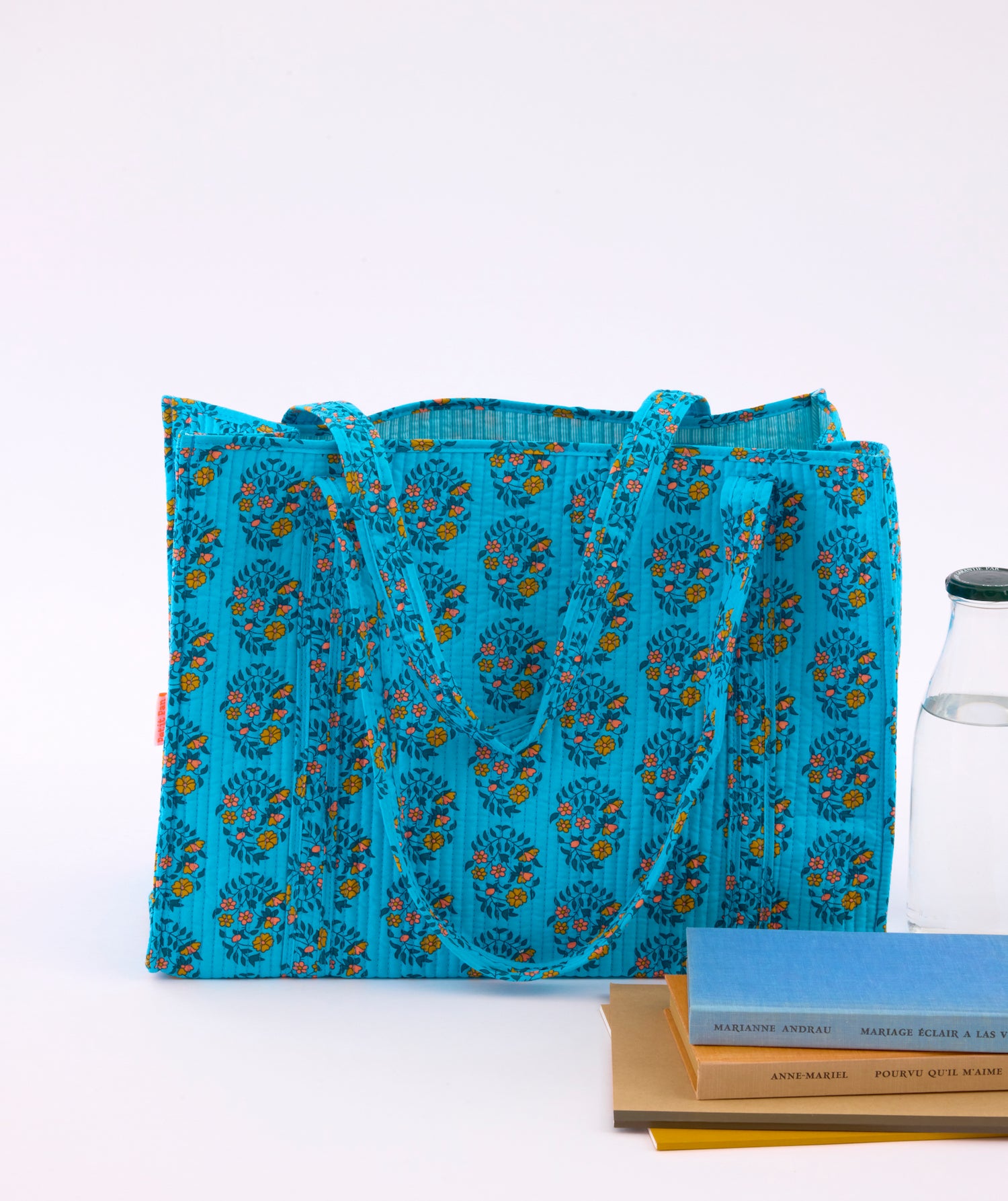 Cabas matelassé shalin turquoise avec des motifs fleuris