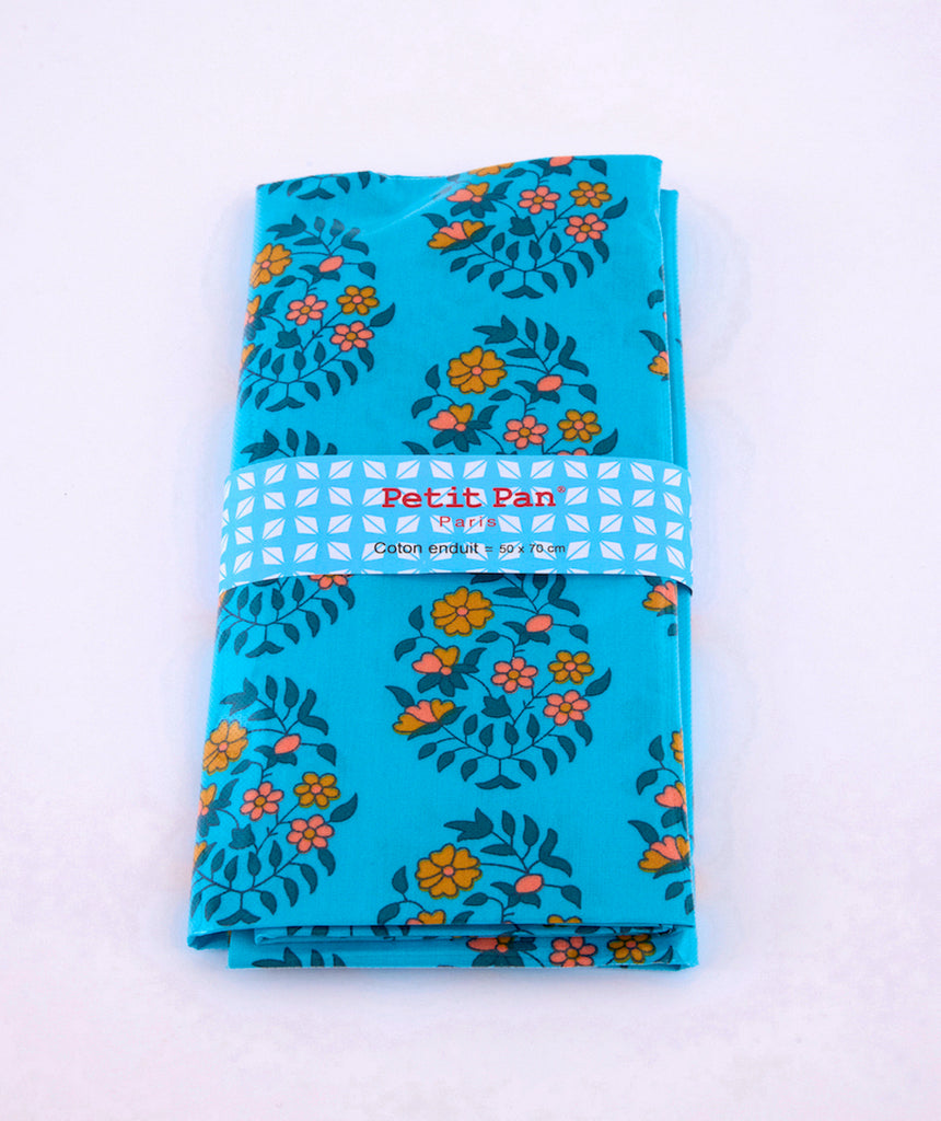 Coupon coton enduit Shalin turquoise avec des motifs fleuris