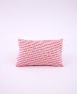 Coussin Moussem rose avec des motifs arrondis