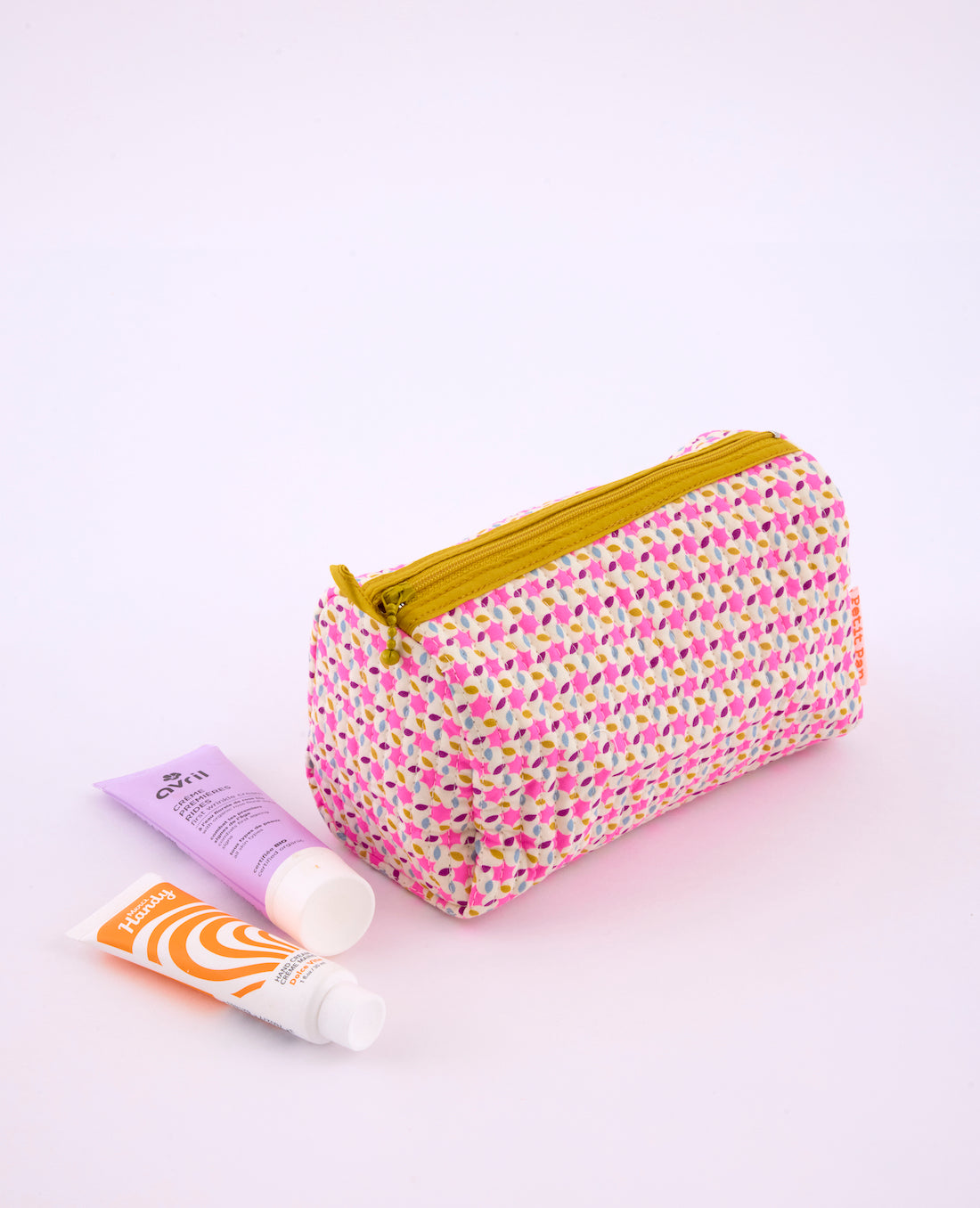 Trousse Mimi Moussem rose avec des motifs géométriques arrondis