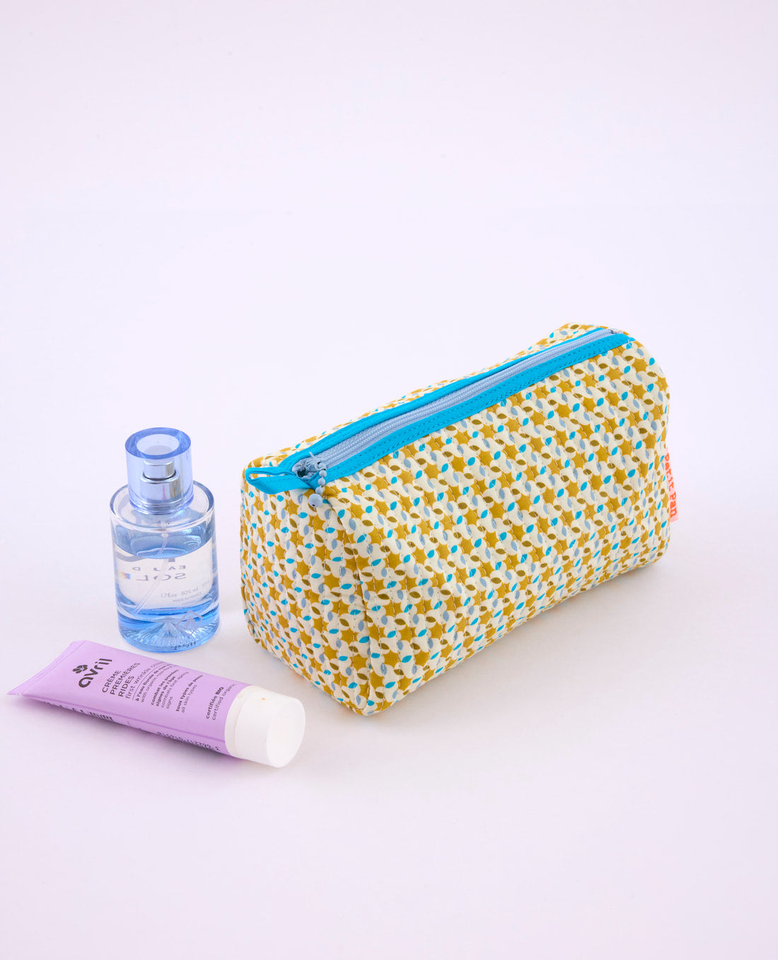 Trousse Mimi Moussem safran avec des motifs géométriques arrondis