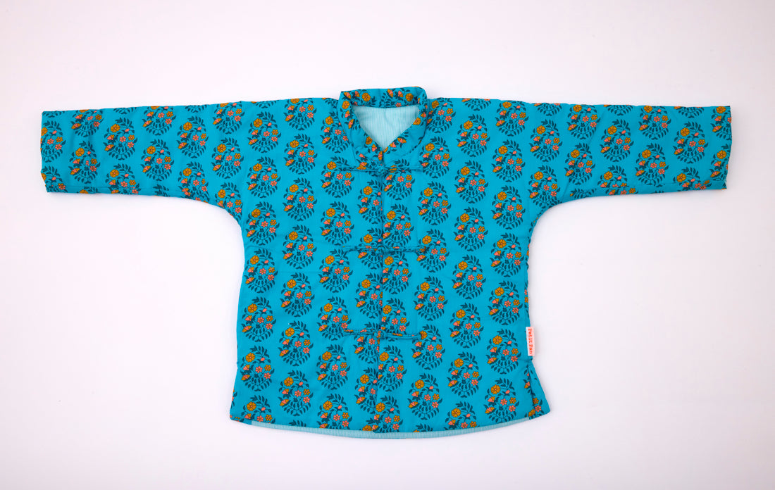 Veste molletonnée enfant Shalin turquoise avec des motifs fleuris